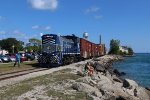 Locals walk past the 1501 to get to the water